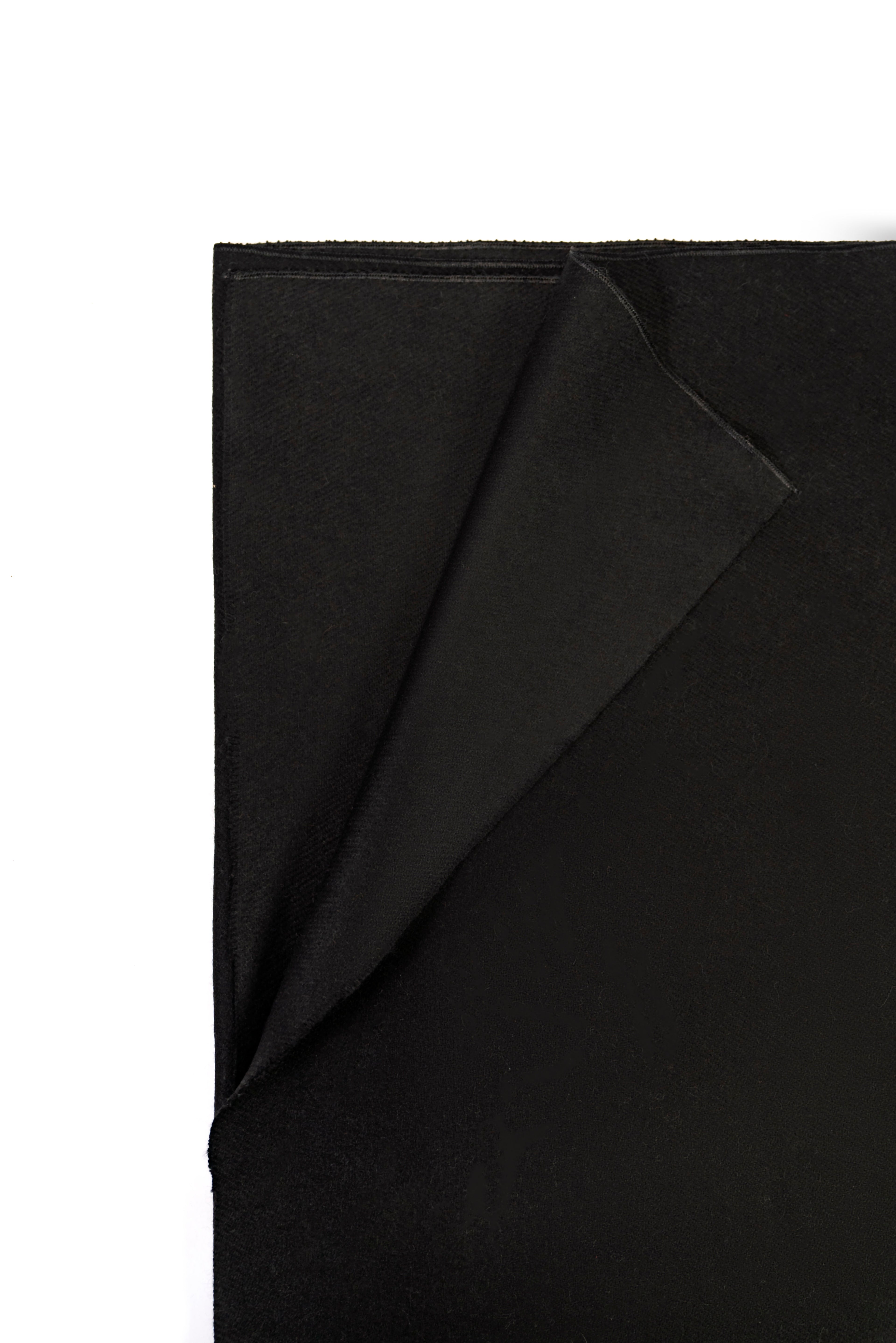 Black heavyweight lamb wool shawl folded corner on white background