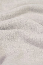 Silver heavyweight lamb wool shawl close-up of handwoven fabric weave texture