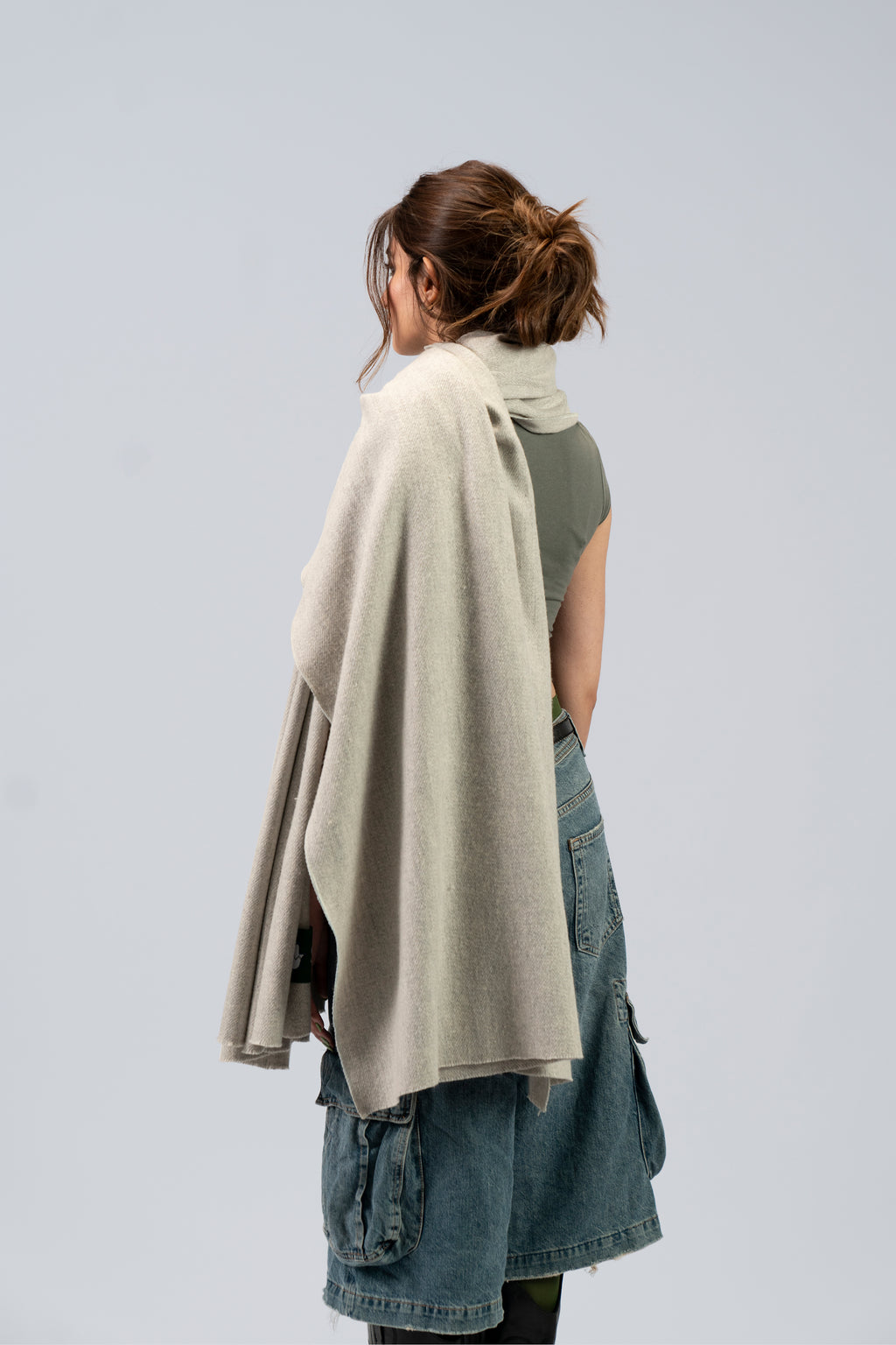 Silver heavyweight lamb wool shawl from behind on female model, back drape view