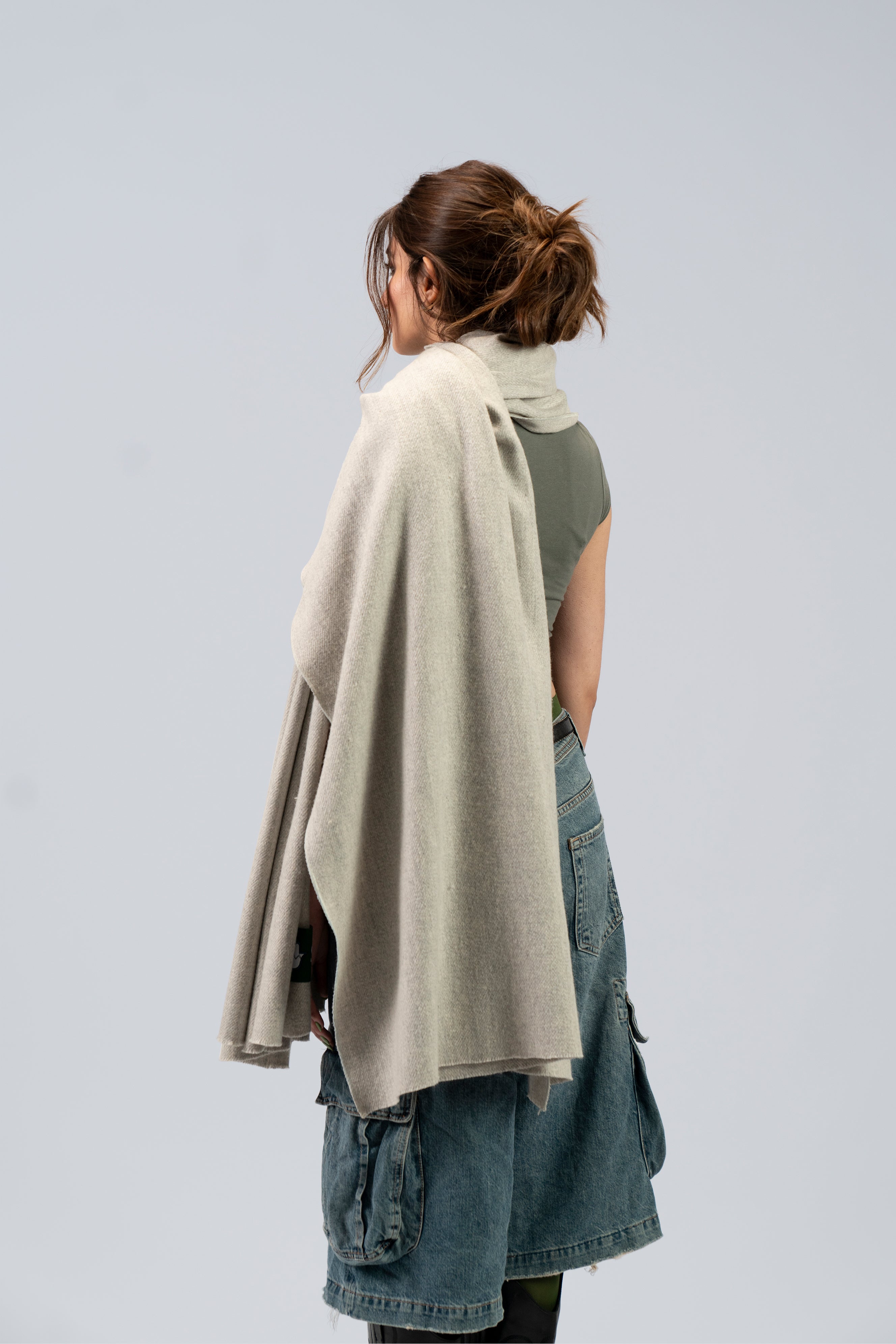 Silver heavyweight lamb wool shawl from behind on female model, back drape view