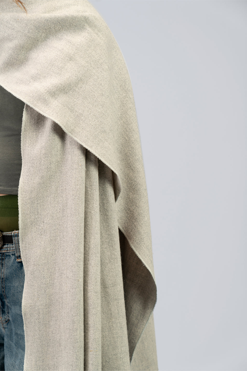Silver heavyweight lamb wool shawl mid-body close-up showing vertical drape and edge