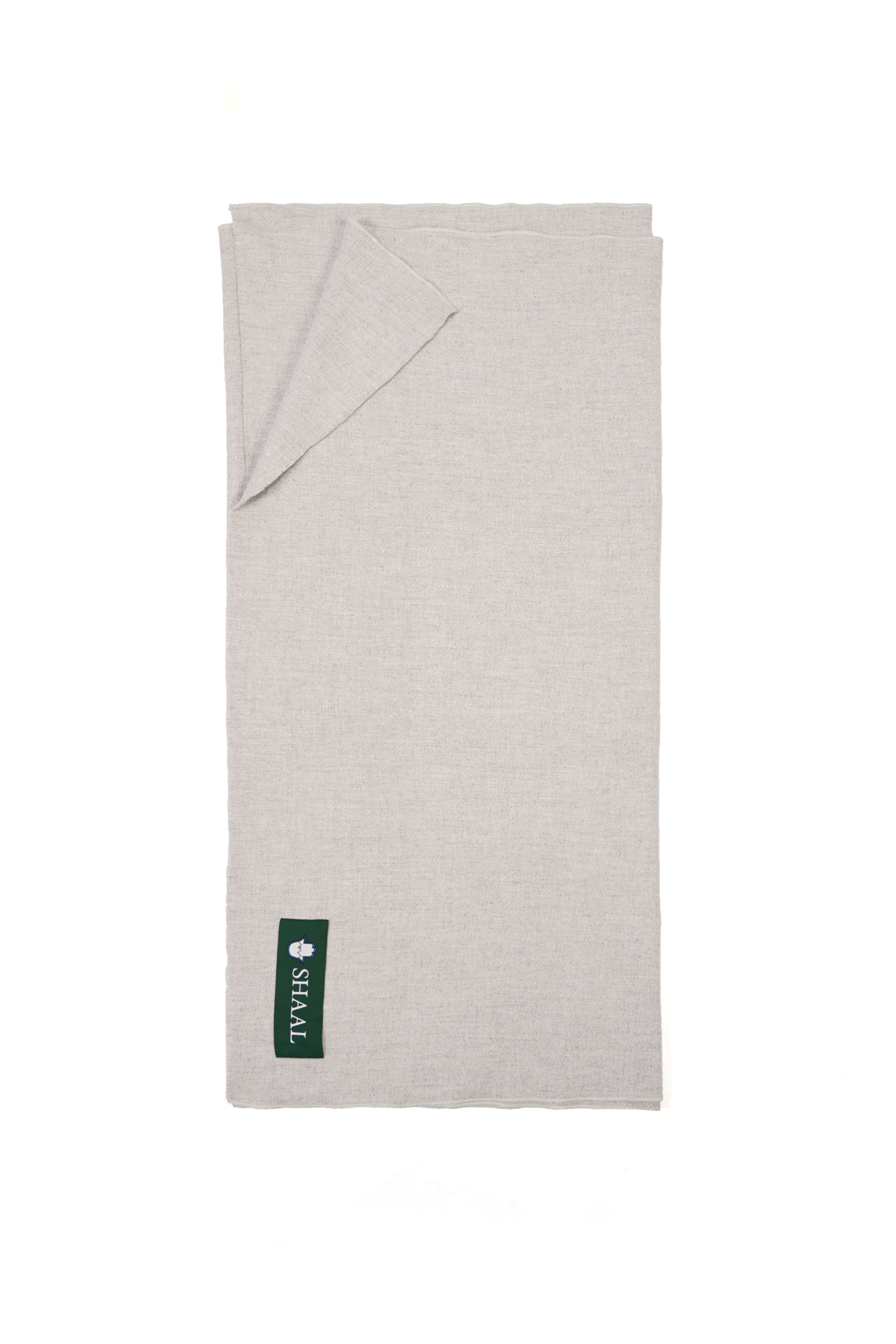Silver heavyweight lamb wool shawl folded flat with SHAAL label, full length