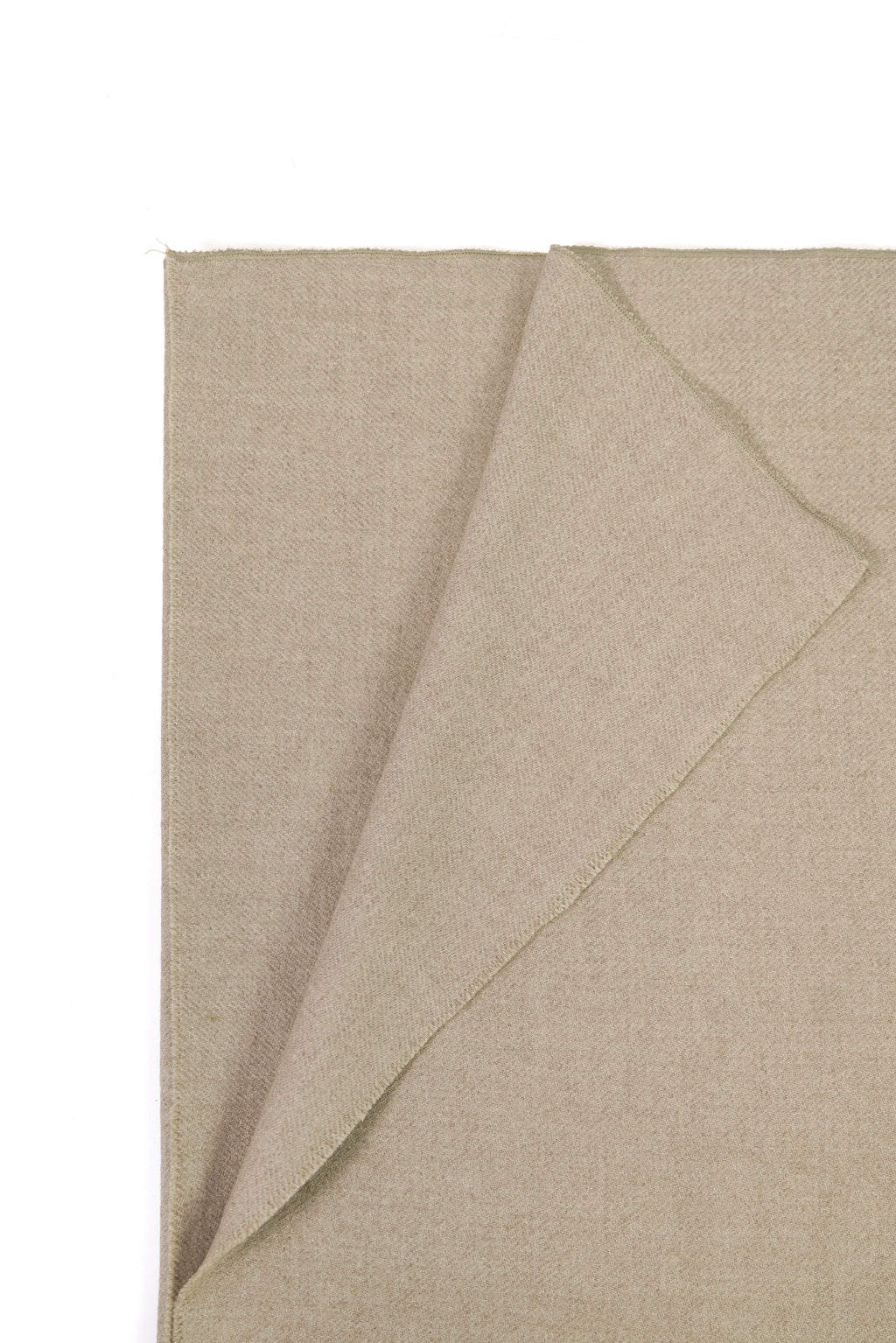 Beige heavyweight lamb wool shawl folded corner on white background