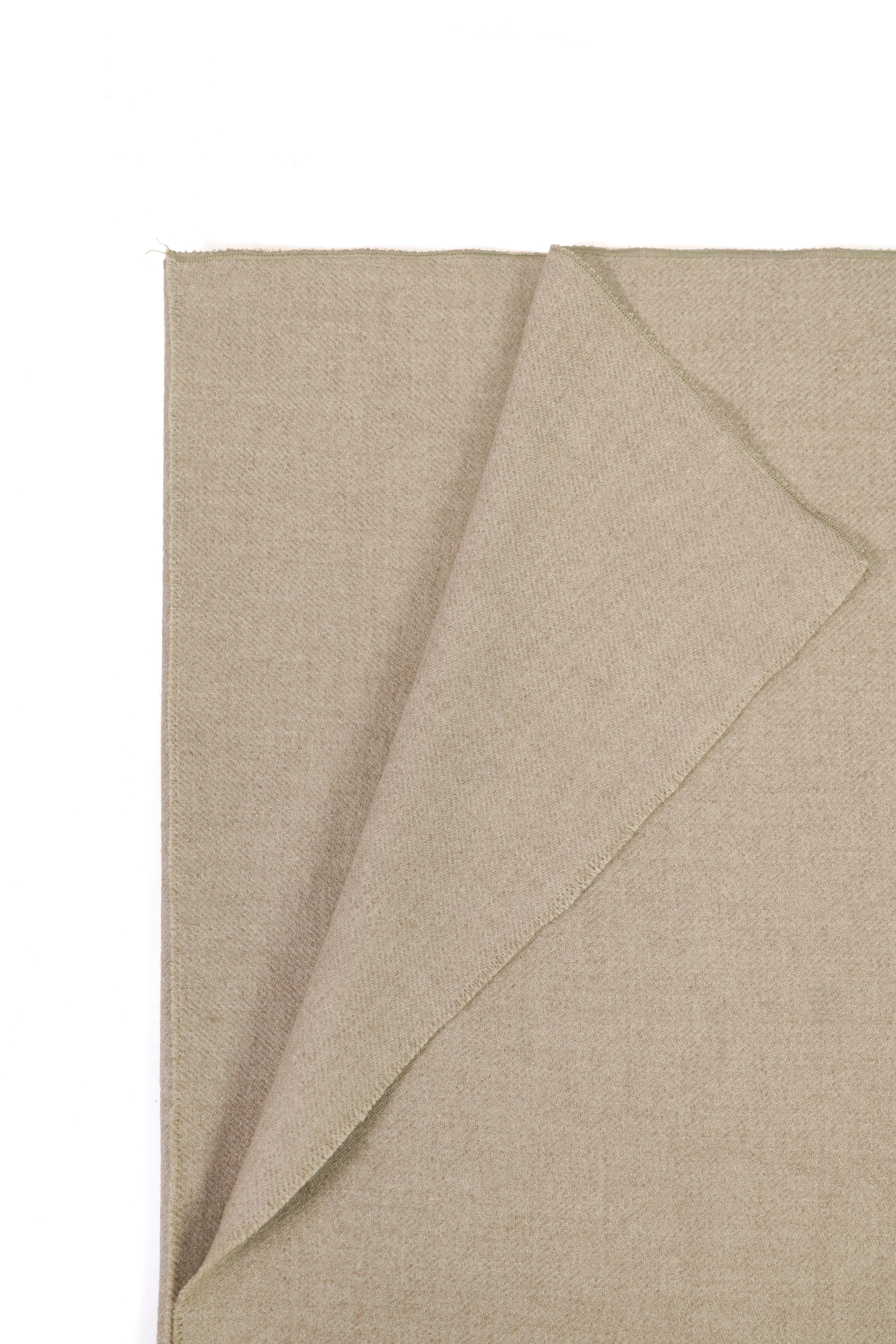 Beige heavyweight lamb wool shawl folded corner on white background