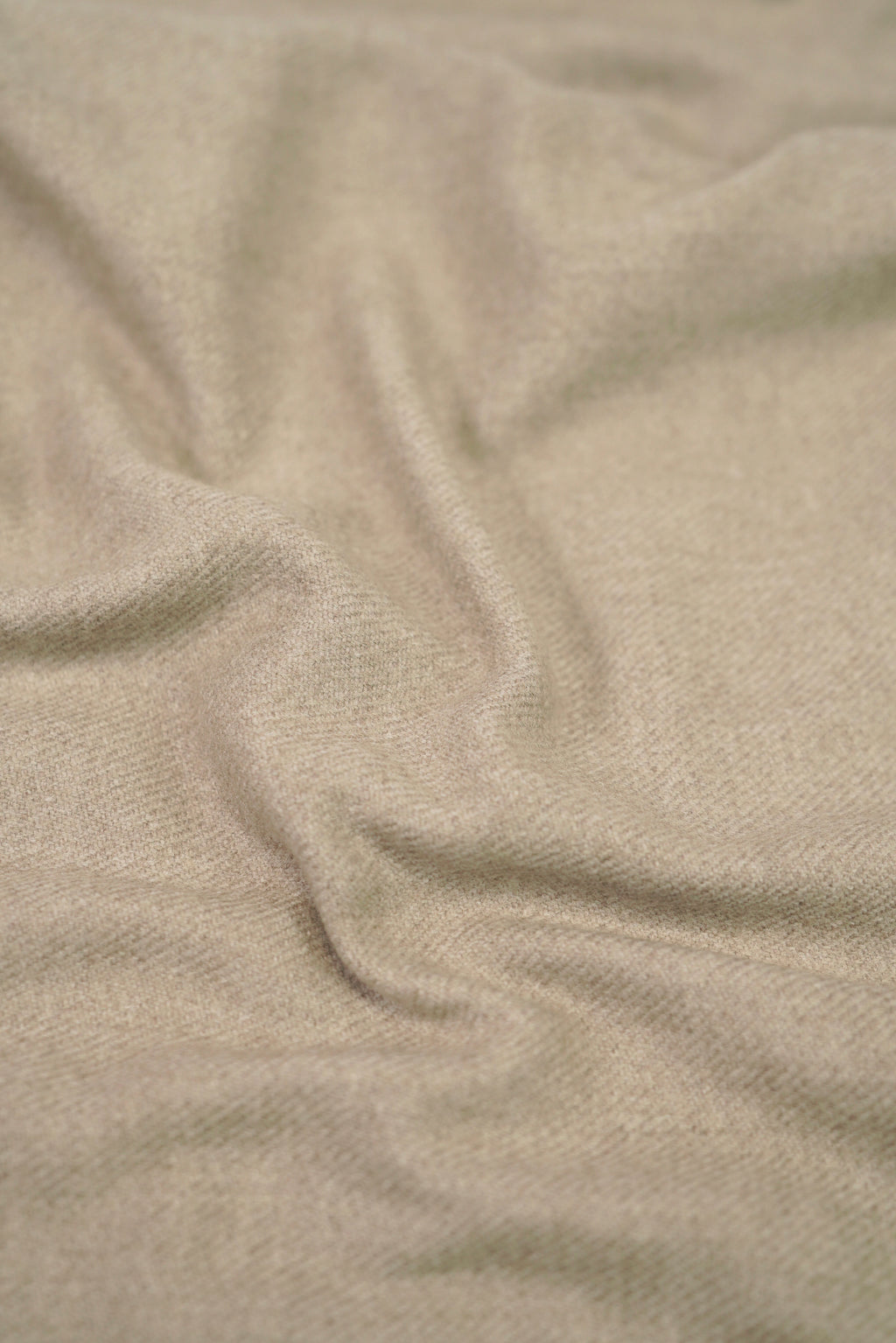 Beige heavyweight lamb wool shawl close-up of handwoven fabric weave