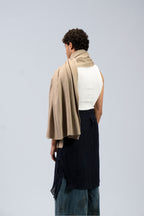 Beige heavyweight lamb wool shawl from behind on male model, back drape view