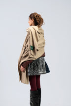 Beige heavyweight lamb wool shawl from behind on female model, back view with SHAAL label