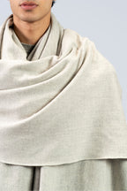 Silver heavyweight lamb wool shawl close-up wrapped around neck and shoulders of male model