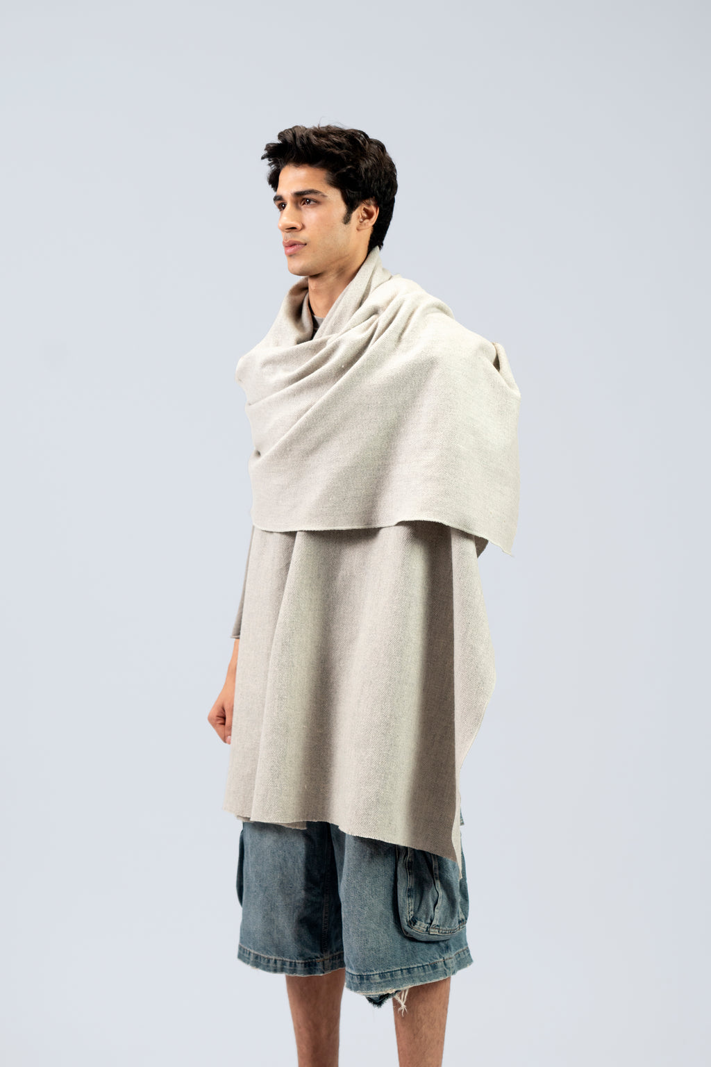 Silver heavyweight lamb wool shawl on male model, three-quarter side view