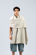 Silver heavyweight lamb wool shawl draped over both shoulders on male model, front view
