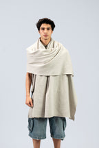 Silver heavyweight lamb wool shawl draped over both shoulders on male model, front view