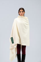 Off-white heavyweight lamb wool shawl wrapped across body on female model, front view