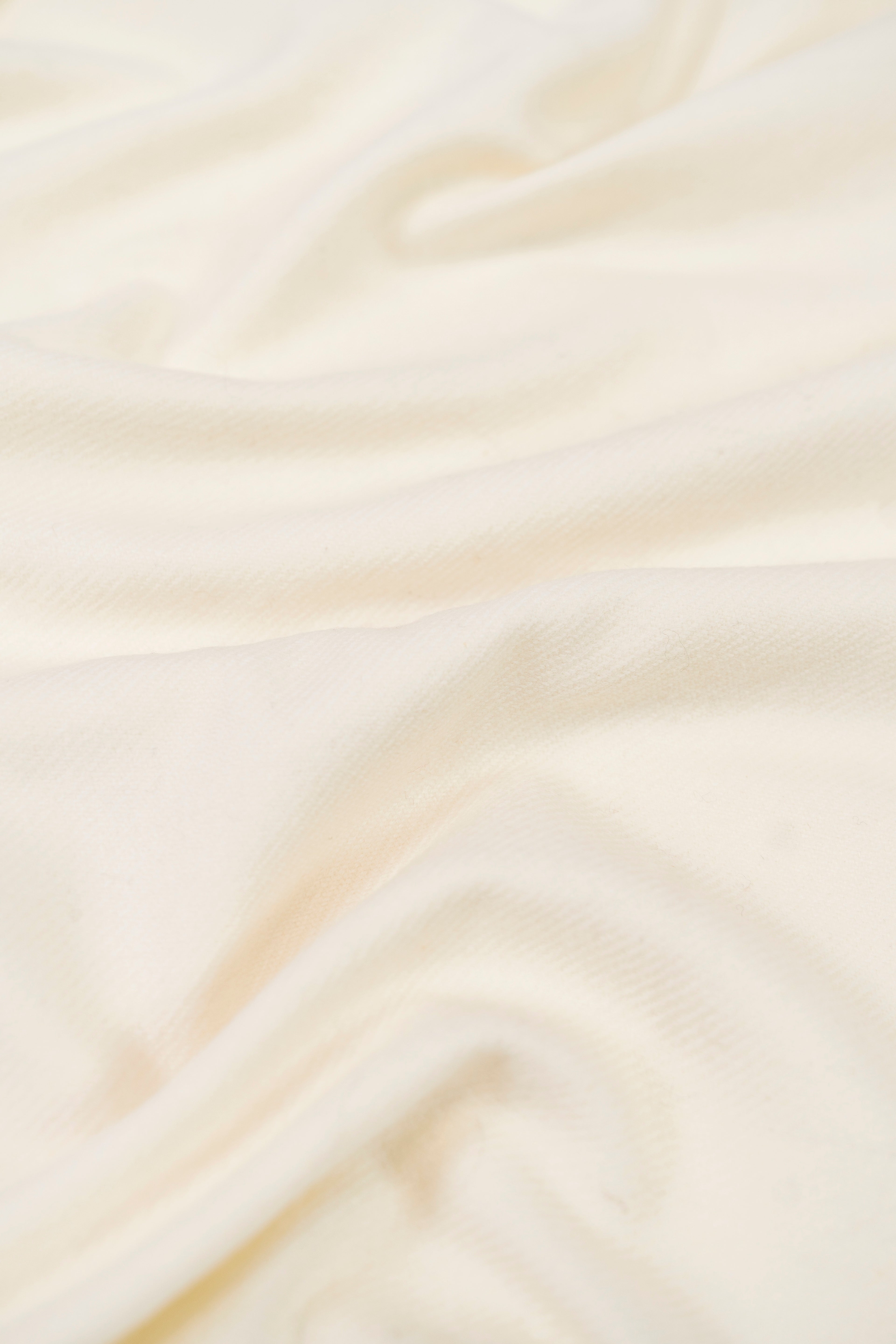 Off-white heavyweight lamb wool shawl close-up of handwoven fabric weave