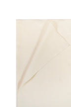 Off-white heavyweight lamb wool shawl folded corner on white background