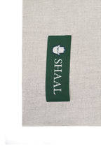 Silver heavyweight lamb wool shawl detail of green SHAAL woven label