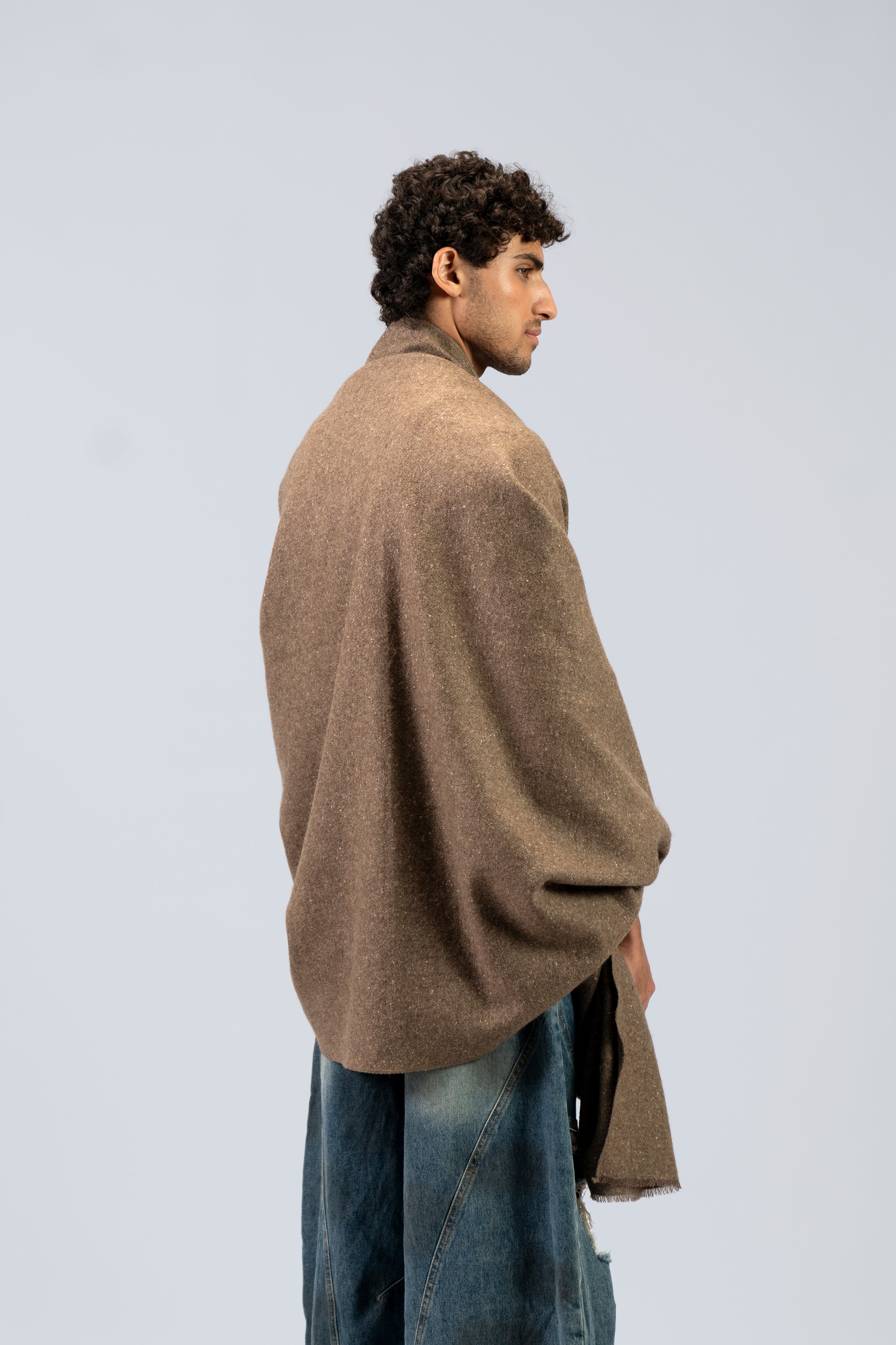 Brown yak wool shawl worn wrapped around neck and chest